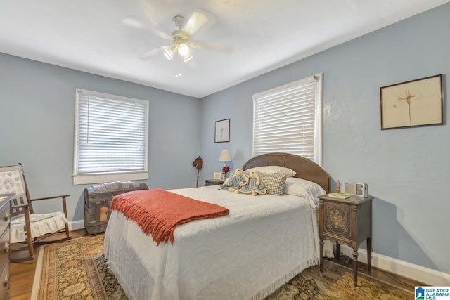 102 E Crest Rd, Hueytown, AL 35023 - bedroom featuring baseboards, wood finished floors, and ceiling fan