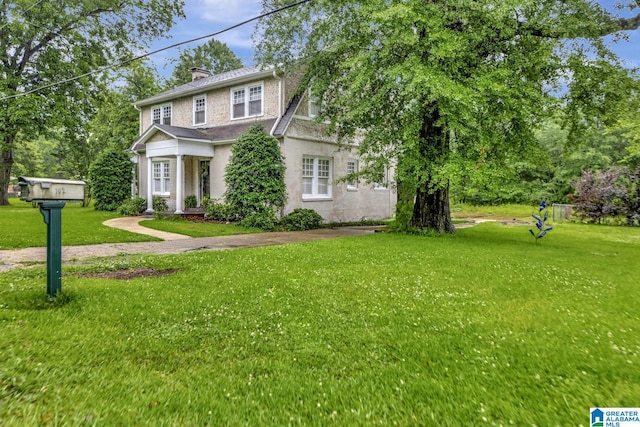 102 E Crest Rd, Hueytown, AL 35023 - view of front of house featuring a front lawn and a chimney