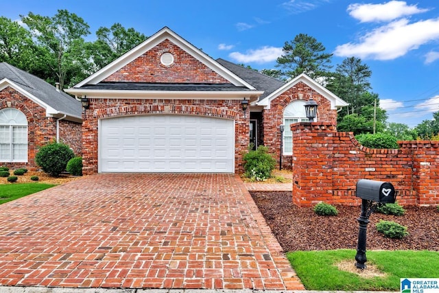 1700 Leisure Ln NW, Cullman, AL 35055 - view of front of property with decorative driveway, an attached garage, and brick siding