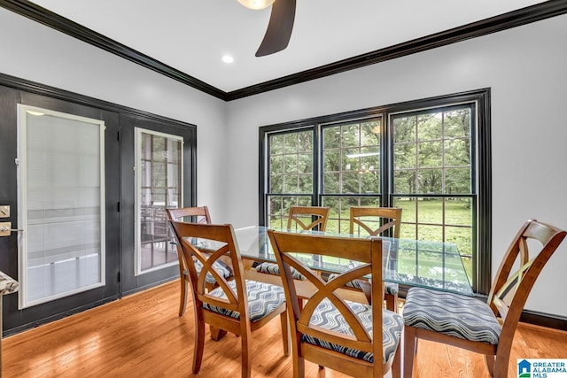 1700 Leisure Ln NW, Cullman, AL 35055 - dining room with wood finished floors, ornamental molding, a ceiling fan, and plenty of natural light