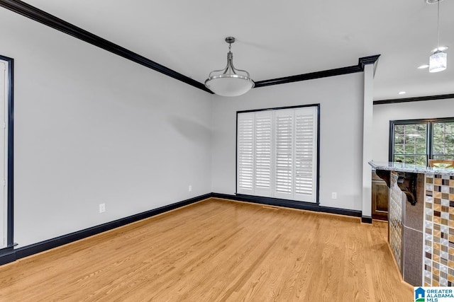 1700 Leisure Ln NW, Cullman, AL 35055 - unfurnished dining area with ornamental molding, light wood-type flooring, baseboards, and recessed lighting