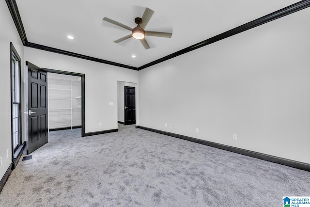 1700 Leisure Ln NW, Cullman, AL 35055 - unfurnished bedroom with crown molding, carpet flooring, baseboards, a spacious closet, and recessed lighting