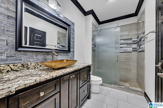 1700 Leisure Ln NW, Cullman, AL 35055 - bathroom featuring ornamental molding, toilet, vanity, a stall shower, and decorative backsplash