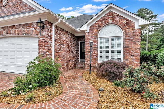 1700 Leisure Ln NW, Cullman, AL 35055 - property entrance with brick siding, an attached garage, and a shingled roof