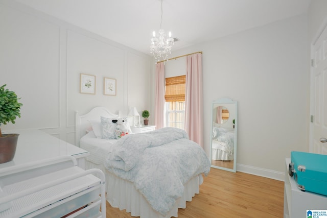 2014 Madison Cir, Chelsea, AL 35043 - bedroom with a chandelier, light wood-type flooring, and baseboards