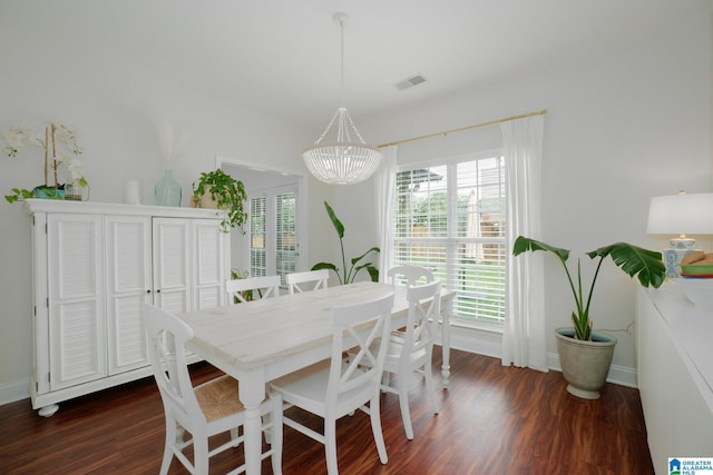 2014 Madison Cir, Chelsea, AL 35043 - dining area featuring dark wood-type flooring, a chandelier, and baseboards