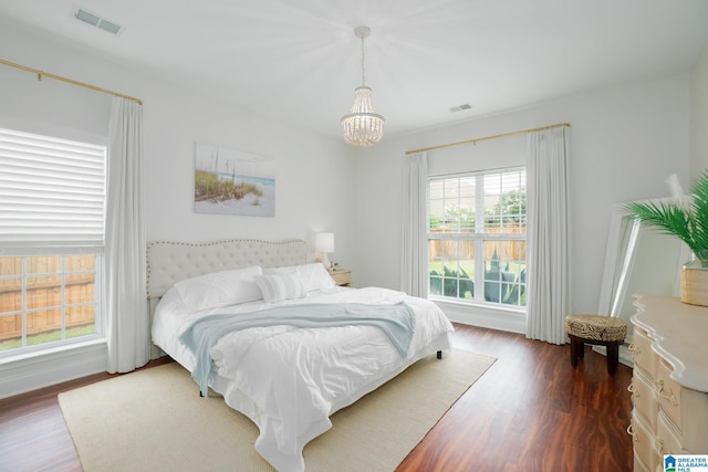 2014 Madison Cir, Chelsea, AL 35043 - bedroom featuring a chandelier and dark wood-style floors