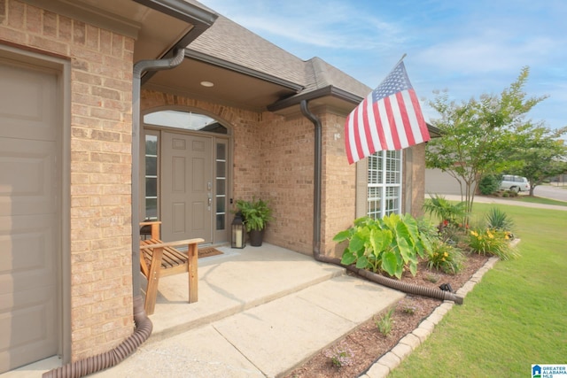 2014 Madison Cir, Chelsea, AL 35043 - doorway to property with brick siding, roof with shingles, a lawn, and an attached garage