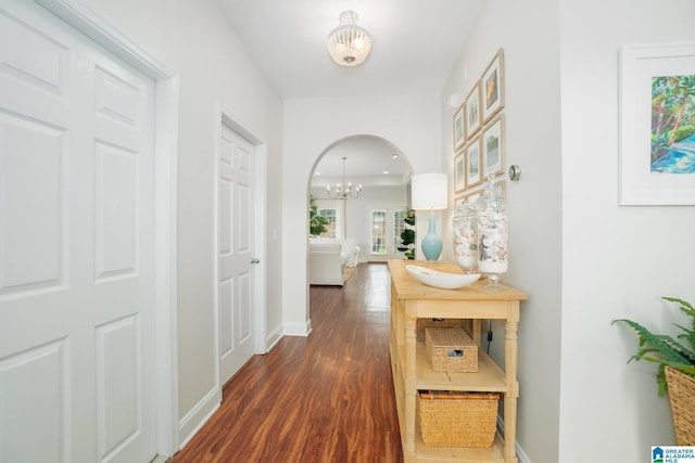 2014 Madison Cir, Chelsea, AL 35043 - corridor with a chandelier, dark wood-style flooring, baseboards, and arched walkways