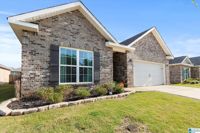 27281 Mckenna Dr, Athens, AL 35613 - single story home with concrete driveway, a garage, a front yard, and brick siding