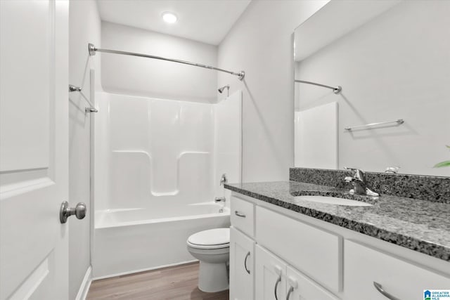 27281 Mckenna Dr, Athens, AL 35613 - bathroom with toilet, vanity, wood finished floors, and  shower combination