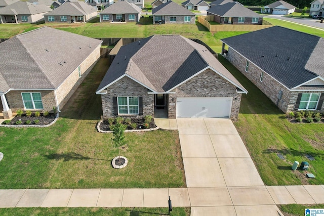 27281 Mckenna Dr, Athens, AL 35613 - view of front of home featuring a residential view, an attached garage, driveway, brick siding, and roof with shingles