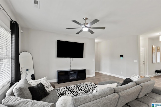 27281 Mckenna Dr, Athens, AL 35613 - living room with a ceiling fan, wood finished floors, plenty of natural light, and baseboards