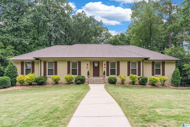 1355 Starcross Dr, Vestavia Hills, AL 35216 - ranch-style house with metal roof, a front yard, and stucco siding