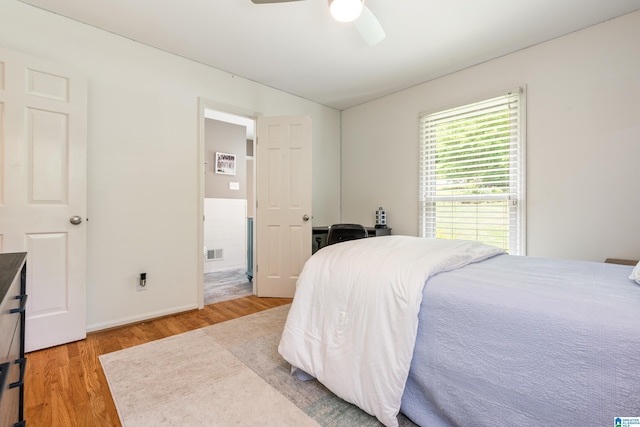 1355 Starcross Dr, Vestavia Hills, AL 35216 - bedroom featuring wood finished floors, vaulted ceiling, and a ceiling fan