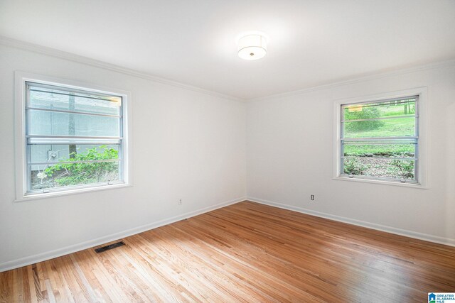 2970 Lake Park Cir, Birmingham, AL 35242 - spare room featuring ornamental molding, baseboards, and light wood-style flooring