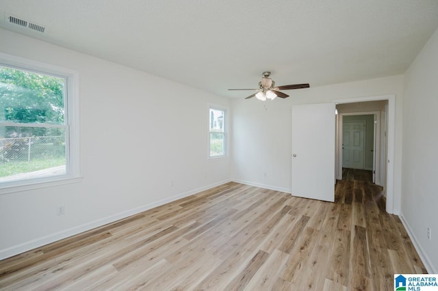 1269 Elm Ave, Tarrant, AL 35217 - unfurnished room featuring light wood-style flooring, a ceiling fan, and baseboards