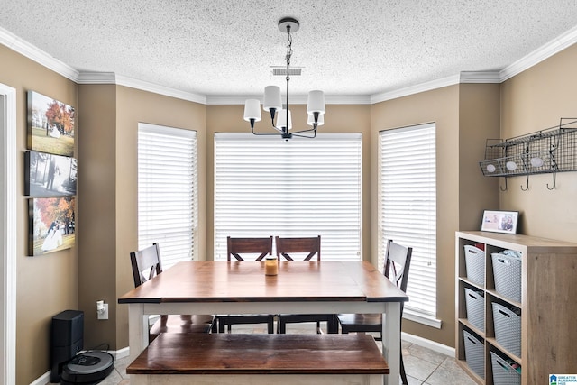 246 Park Place Way, Alabaster, AL 35007 - dining area featuring a chandelier, a textured ceiling, healthy amount of natural light, light tile patterned floors, and crown molding