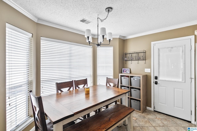 246 Park Place Way, Alabaster, AL 35007 - dining space featuring a chandelier, crown molding, a textured ceiling, and light tile patterned floors