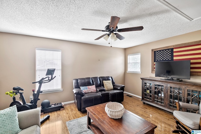 246 Park Place Way, Alabaster, AL 35007 - living area featuring a ceiling fan, wood finished floors, baseboards, and a textured ceiling