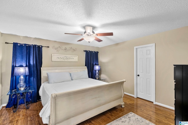246 Park Place Way, Alabaster, AL 35007 - bedroom featuring wood finished floors, baseboards, a textured ceiling, and ceiling fan
