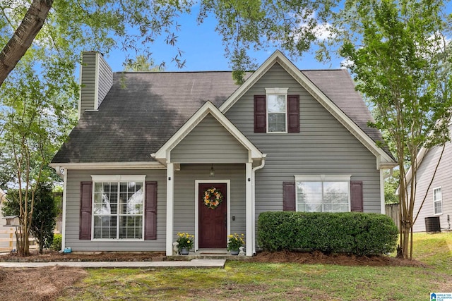 246 Park Place Way, Alabaster, AL 35007 - view of front of house with a chimney, central air condition unit, a front yard, and a shingled roof