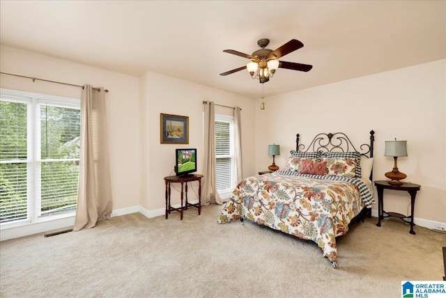 1222 Eagle Park Rd, Birmingham, AL 35242 - carpeted bedroom with multiple windows, baseboards, and ceiling fan