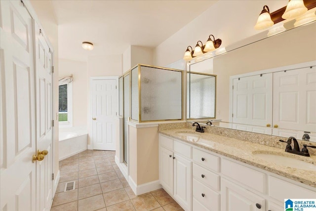 1222 Eagle Park Rd, Birmingham, AL 35242 - bathroom with a shower stall, a garden tub, tile patterned flooring, and double vanity