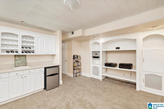 1222 Eagle Park Rd, Birmingham, AL 35242 - kitchen featuring stainless steel fridge, light colored carpet, white cabinets, light countertops, and wooden ceiling
