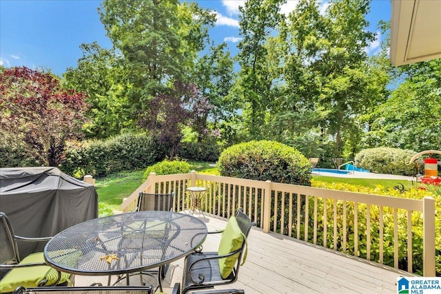 1222 Eagle Park Rd, Birmingham, AL 35242 - deck featuring outdoor dining area, a pool, grilling area, and view of scattered trees