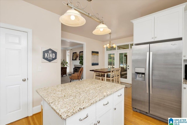 1222 Eagle Park Rd, Birmingham, AL 35242 - kitchen featuring stainless steel fridge, light wood-type flooring, light stone countertops, and white cabinets