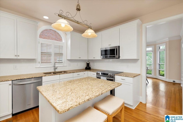 1222 Eagle Park Rd, Birmingham, AL 35242 - kitchen featuring stainless steel appliances, a sink, white cabinetry, recessed lighting, and crown molding