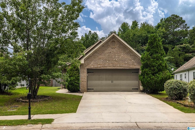 5296 Promenade Dr, Trussville, AL 35173 - view of front of house with brick siding, a front lawn, concrete driveway, and a garage