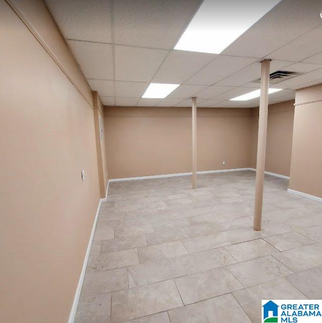 5967 Honeysuckle Cir, Pinson, AL 35126 - finished below grade area featuring a paneled ceiling and baseboards