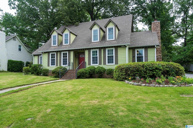 3504 William And Mary Rd, Hoover, AL 35216 - new england style home with roof with shingles, a front yard, and a chimney