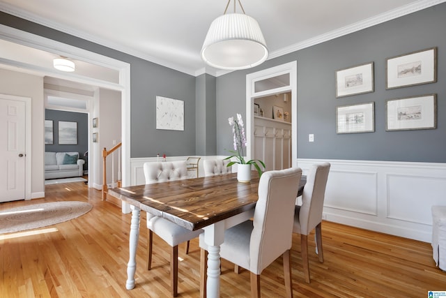 208 Maple Trce, Hoover, AL 35244 - dining room with light wood finished floors, ornamental molding, a wainscoted wall, and a decorative wall