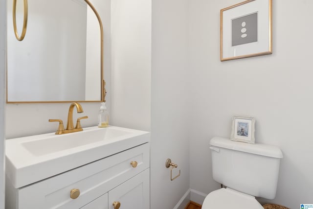 208 Maple Trce, Hoover, AL 35244 - bathroom with toilet, vanity, and baseboards