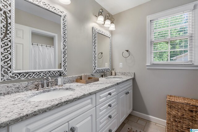 208 Maple Trce, Hoover, AL 35244 - bathroom with double vanity, baseboards, and tile patterned flooring