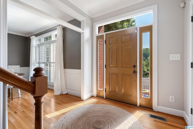 208 Maple Trce, Hoover, AL 35244 - entrance foyer featuring plenty of natural light, ornamental molding, light wood-type flooring, and wainscoting