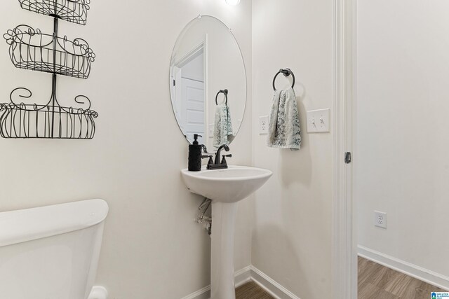 4865 Mae Beth Cir, Mount Olive, AL 35117 - bathroom with toilet, wood finished floors, and baseboards
