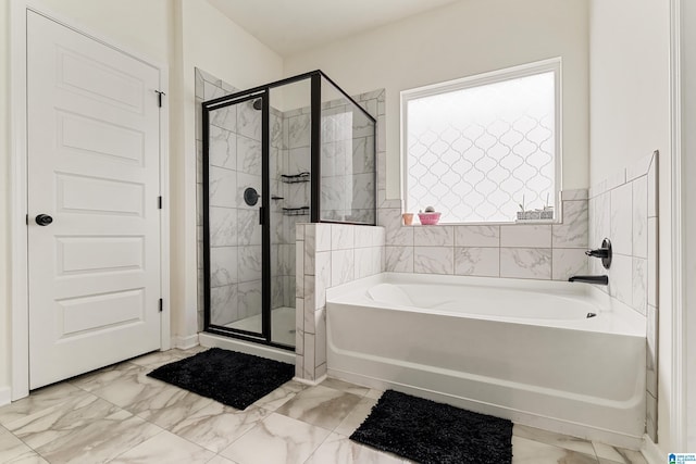 4865 Mae Beth Cir, Mount Olive, AL 35117 - bathroom featuring a bath, marble look tiles, and a stall shower