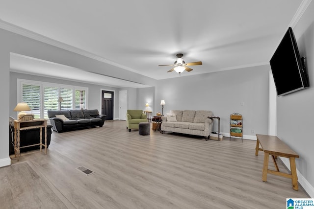 2028 Moncrief Rd, Gardendale, AL 35071 - living area with ceiling fan, light wood-style flooring, baseboards, and crown molding