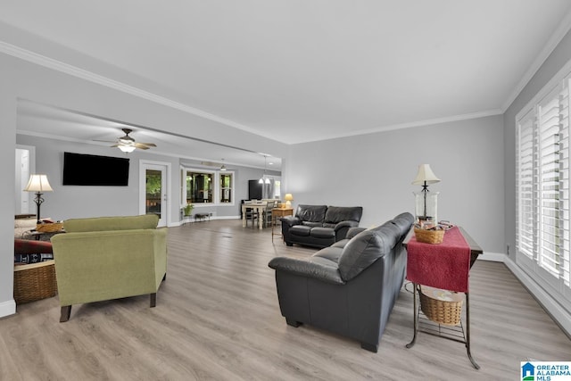 2028 Moncrief Rd, Gardendale, AL 35071 - living area featuring light wood-style floors, ornamental molding, baseboards, and a ceiling fan