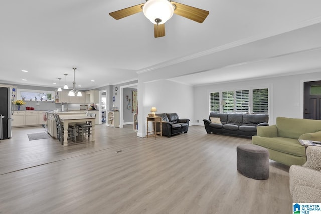 2028 Moncrief Rd, Gardendale, AL 35071 - living area featuring recessed lighting, light wood-style floors, ornamental molding, baseboards, and ceiling fan