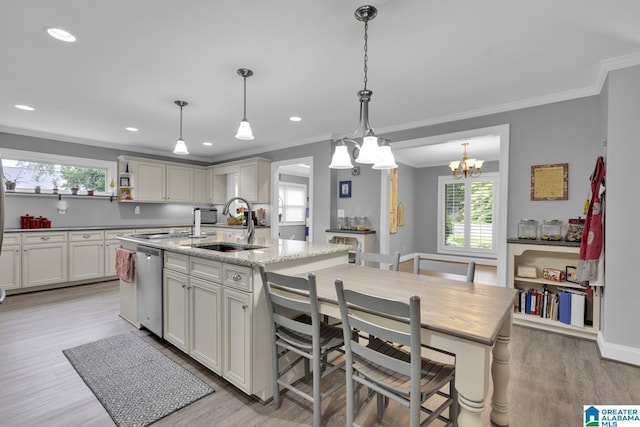 2028 Moncrief Rd, Gardendale, AL 35071 - kitchen featuring stainless steel dishwasher, a sink, crown molding, light wood-style flooring, and a kitchen island with sink