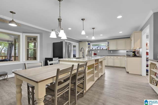 2028 Moncrief Rd, Gardendale, AL 35071 - kitchen featuring open shelves, crown molding, freestanding refrigerator, a sink, and light wood-type flooring