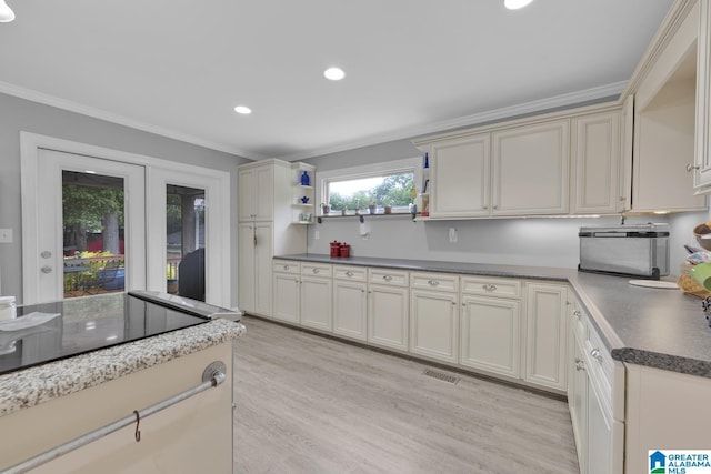 2028 Moncrief Rd, Gardendale, AL 35071 - kitchen with ornamental molding, open shelves, light wood-style flooring, recessed lighting, and dark countertops