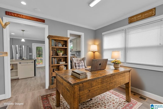 2028 Moncrief Rd, Gardendale, AL 35071 - office featuring ornamental molding, light wood-type flooring, and baseboards