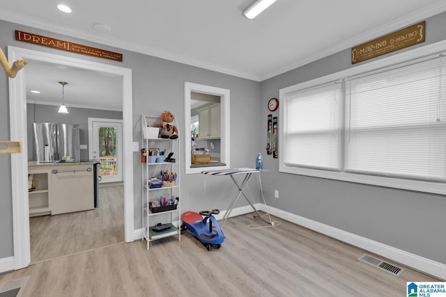 2028 Moncrief Rd, Gardendale, AL 35071 - dining area featuring ornamental molding, light wood-type flooring, baseboards, and recessed lighting