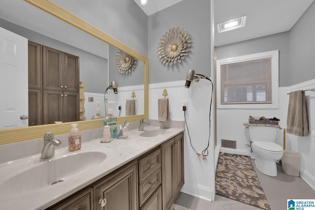 2028 Moncrief Rd, Gardendale, AL 35071 - bathroom with double vanity and toilet